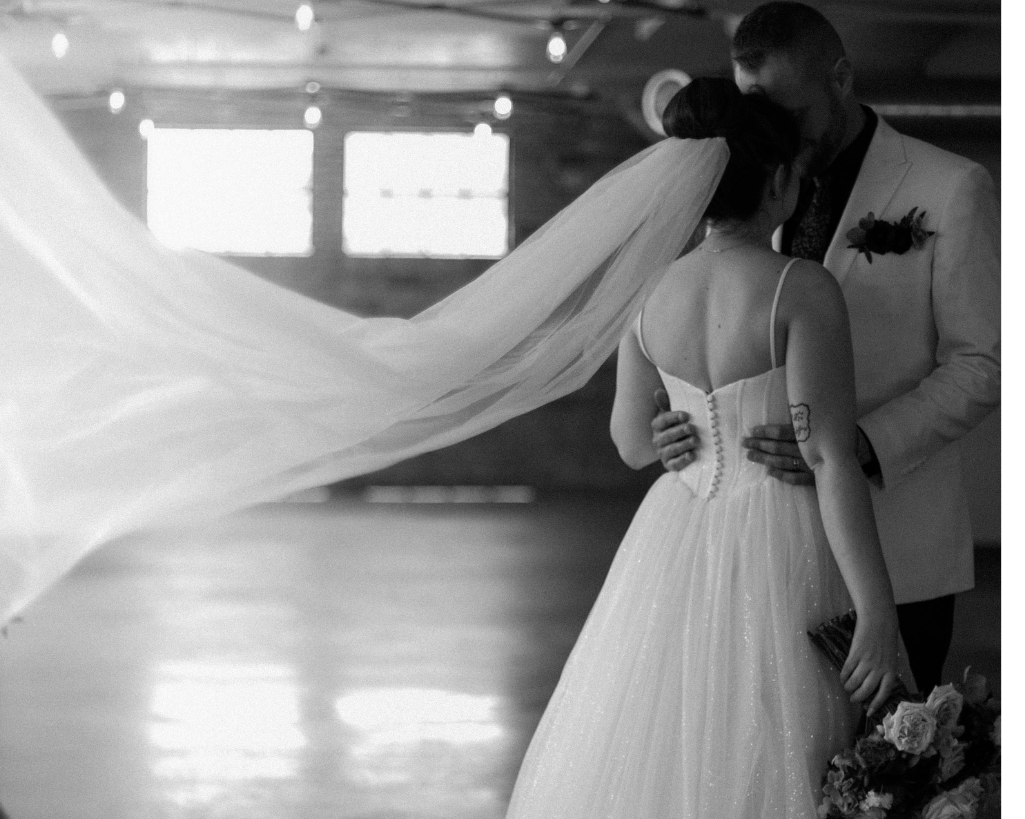 Bride's veil flows behind her