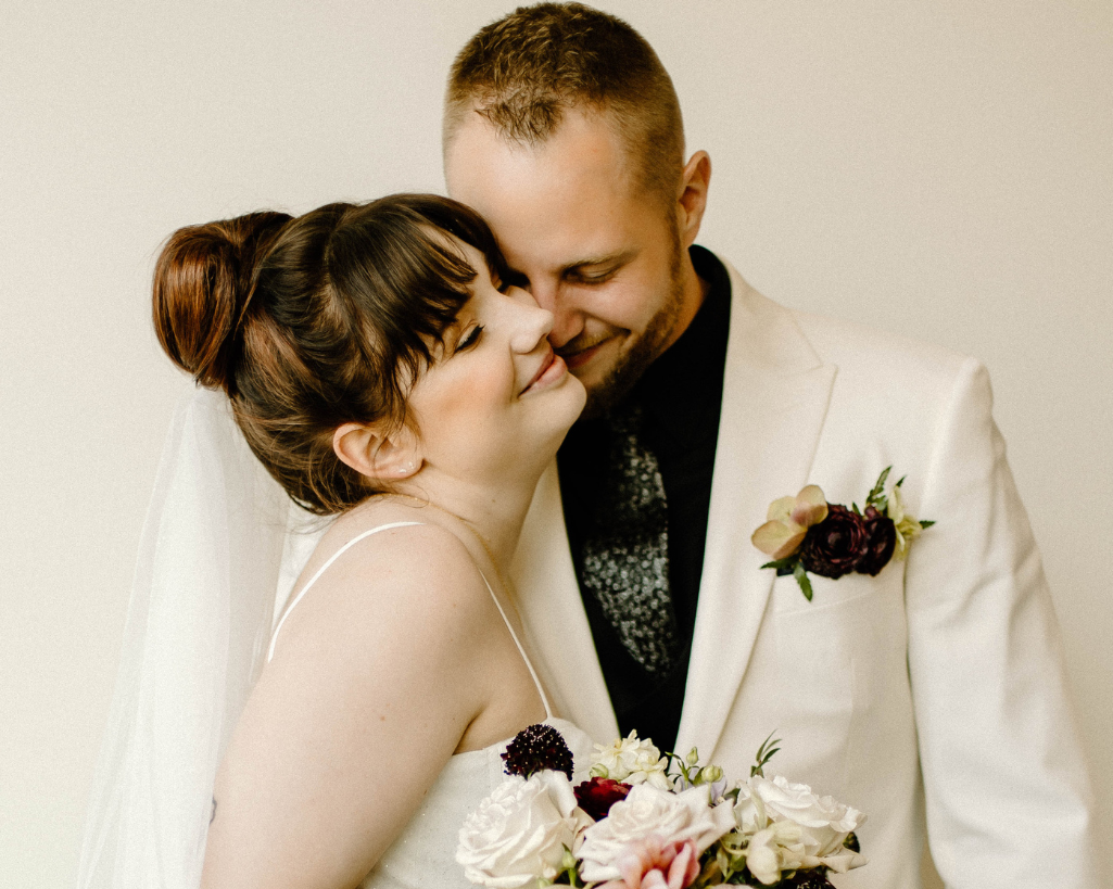 Bride and groom share an embrace with their eyes closed during their bridal portraits