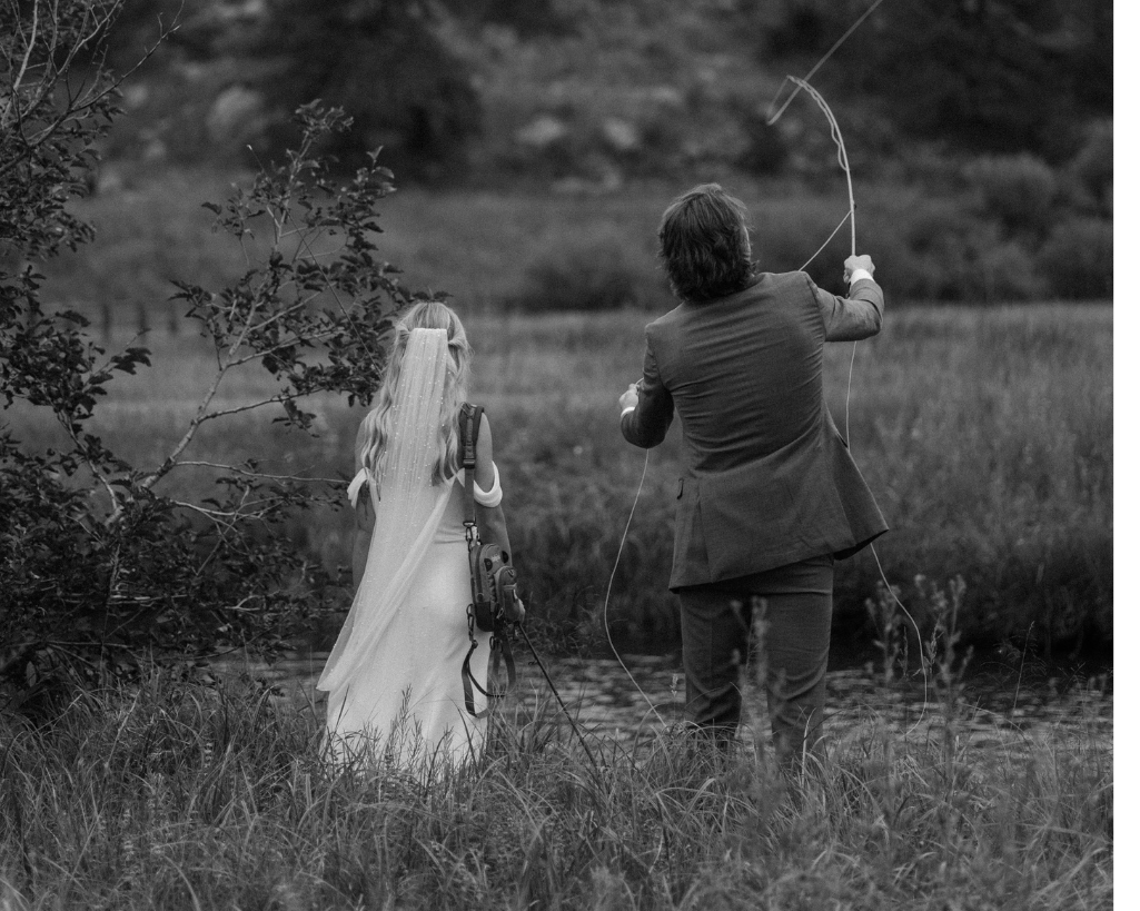 Bride and groom cast out while fly fishing after ceremony.