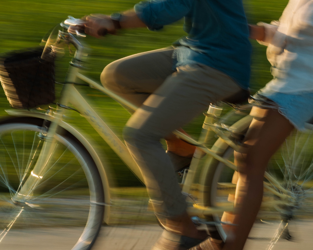 Motion blur romantic couple rides bike