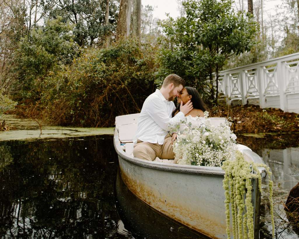 Groom holds bride's face at elopement in Cypress Gardens
