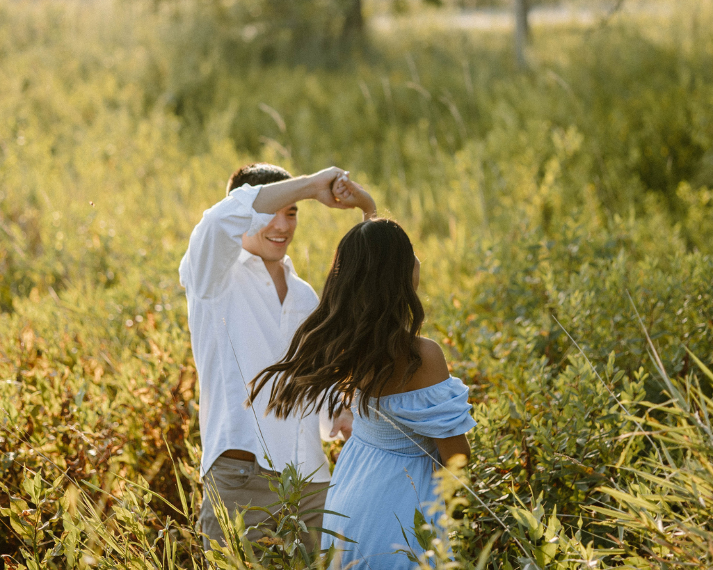 Couples dances in a golden field