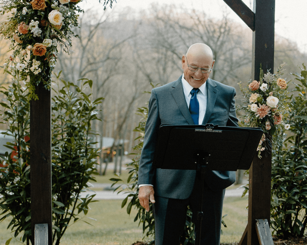 Bride's grandpa officiates mountain wedding ceremony in North Carolina wedding in the Blue Ridge Mountains.