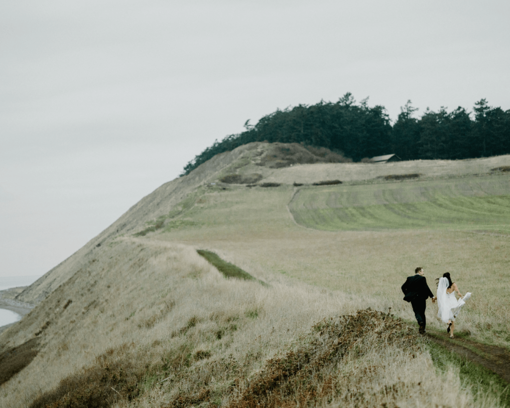 Bride and groom run off together in kitschy Washington elopement along the Puget Sound shoreline.