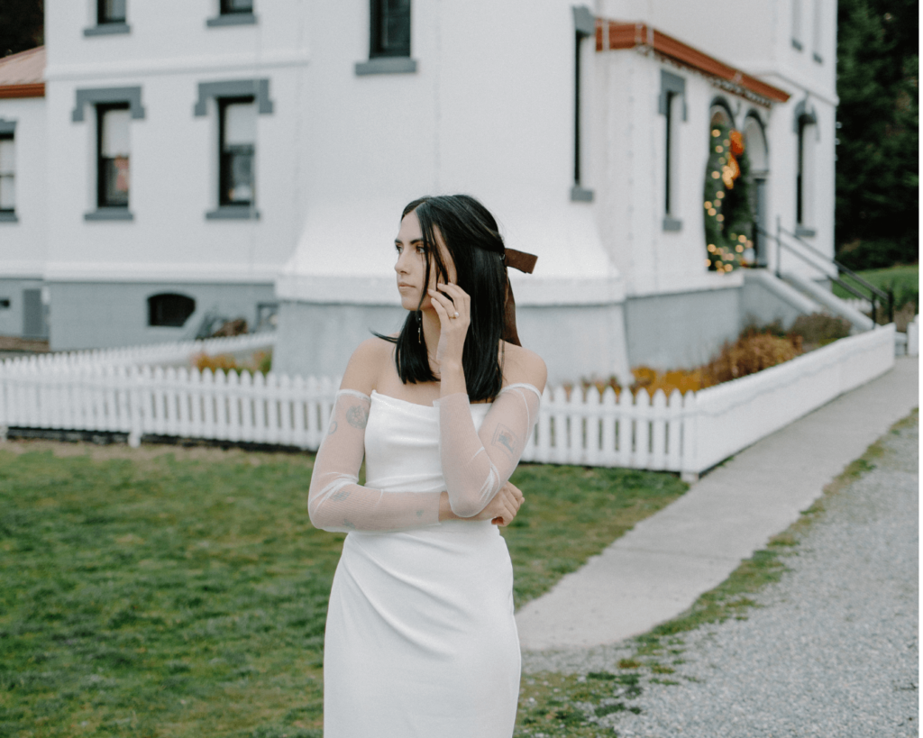 Bride looks off into the distance in portrait for anti-bride elopement