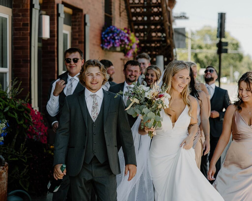 Bridal party strolls down main strip downtown in Minnesota wedding