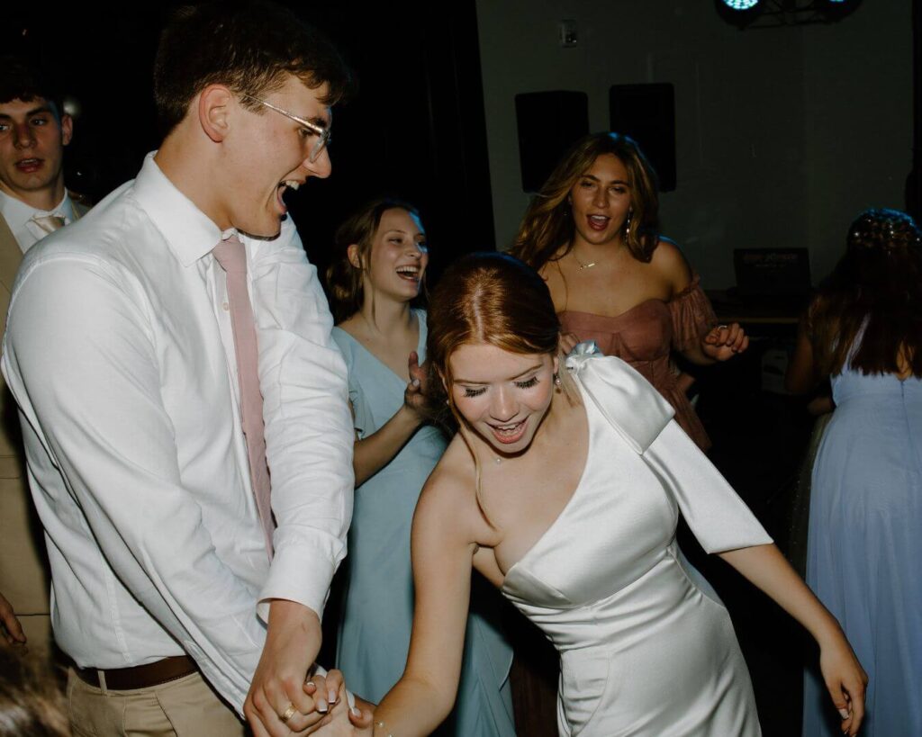 Bride and groom dance during wedding reception in Iowa.
