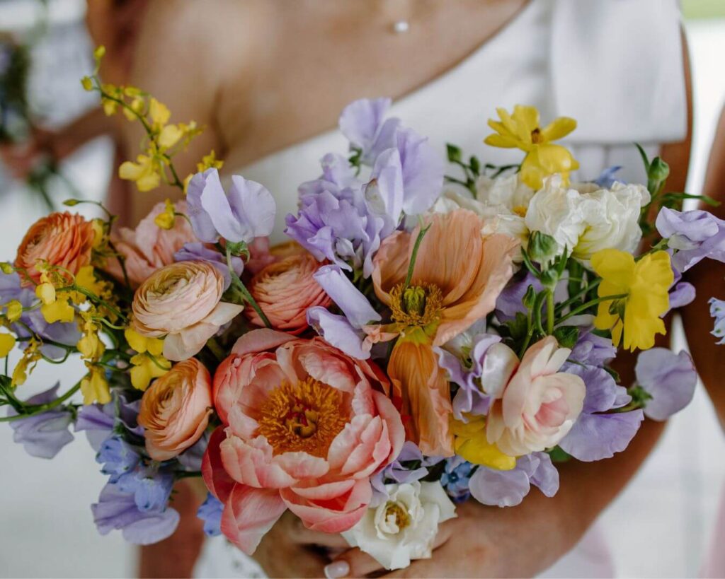 Spring wedding ideas with pastel bridal bouquet arrangement.