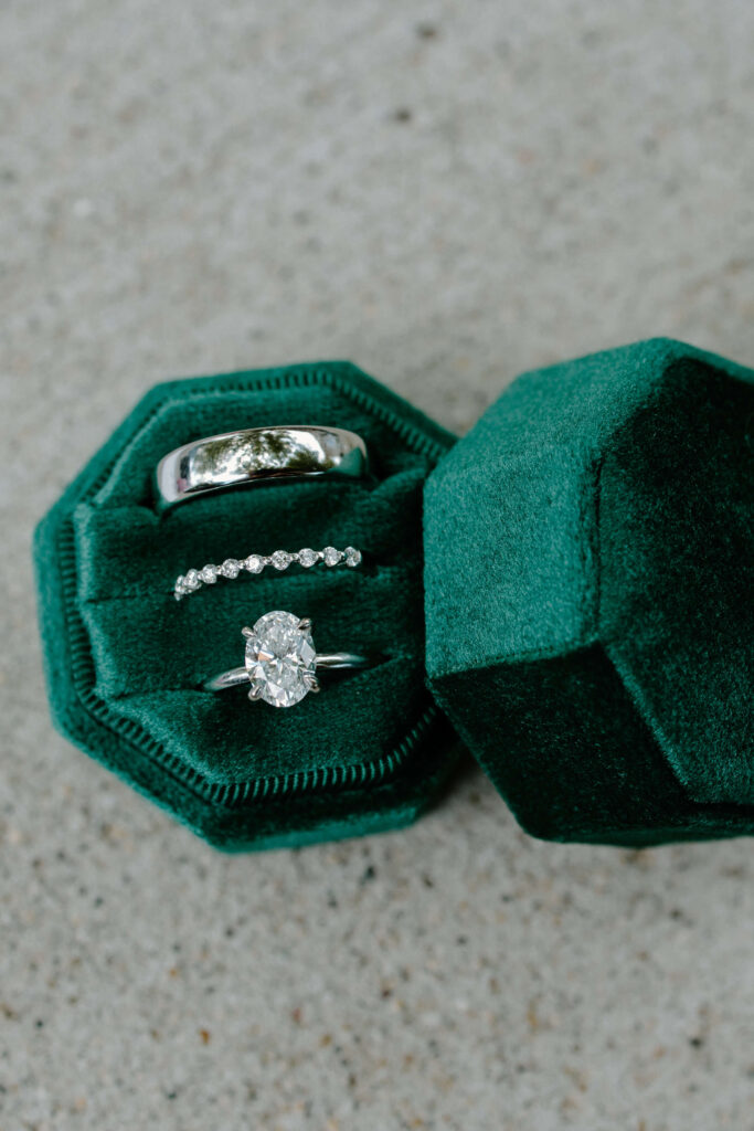 Emerald green box with bride's and groom's rings