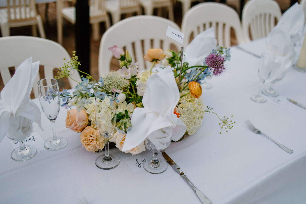 Romantic floral tablescapes at garden wedding reception