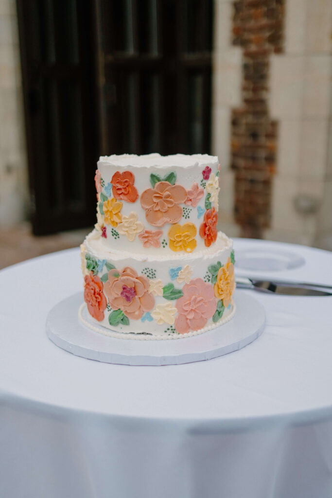 Cute, floral wedding cake at garden wedding