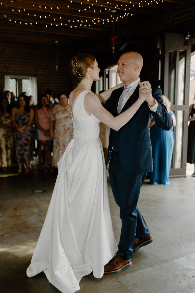 Bride and groom waltz in their first dance as husband and wife