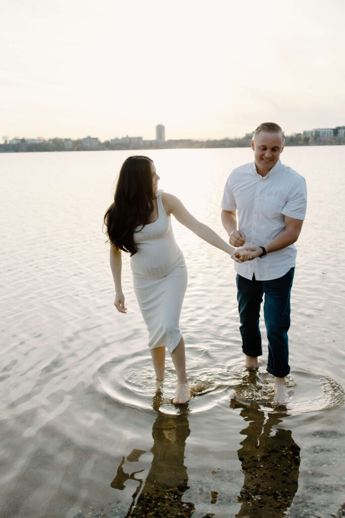 Expecting couple makes ripples through the water of Bde Mka Ska.