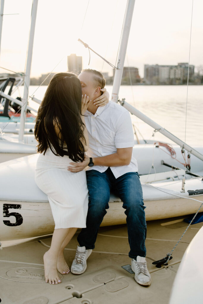 Man and woman kiss on harbor of Bde Mka Ska.